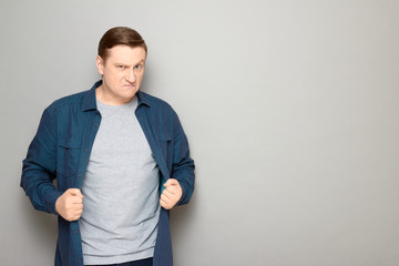 Portrait of furious annoyed blond mature man with angry expression