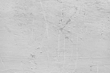 White wall background. White plastered wall with scratches and bumps.