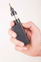 Electronic Cigarette Vape in the Hand of a Male