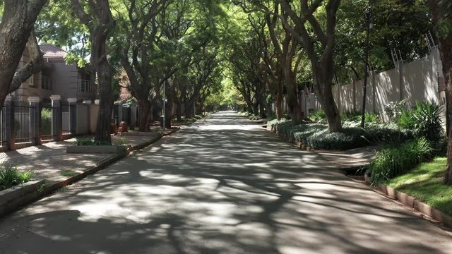 Empty affluent suburban street in Johannesburg, South Africa during the covid-19 coronavirus lockdown.