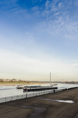 River barge in Dusseldorf, view from the shore, late autumn, early winter, Germany