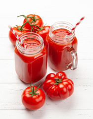 Fresh tomato juice and ripe tomatoes
