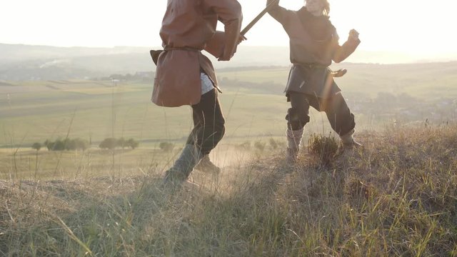 Legs of Viking Warriors, fighting with swords.