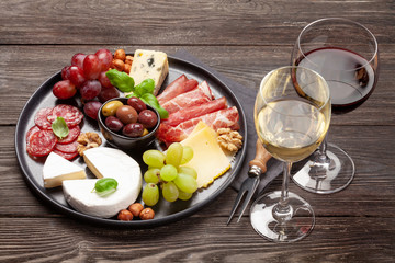 Cheese, meat, grapes and olives antipasto
