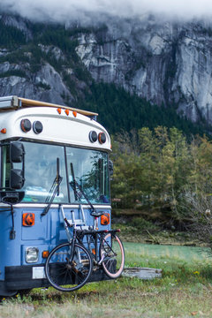 School bus converted parked front of Squamish Chief Mountain granite