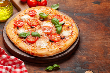 Tasty homemade pizza with tomatoes