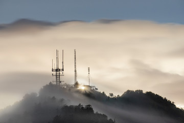 View of radio towers on Mount Wilson during fog