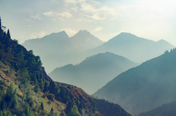 mountain landscape road high mountains with haze and clouds