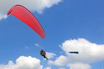Paraglider being towed on a winch launch	