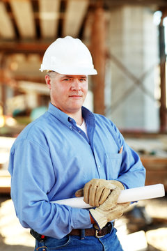 Male construction foreman looking at camera