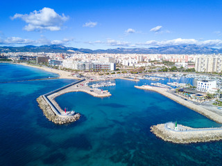 Sunny day in the Marina del Portixol and its promenade.