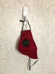 A mask hangs to air out after being worn during coronavirus 