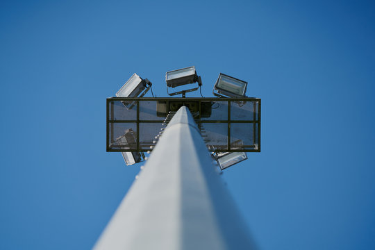 daytime stadium lights seen from below