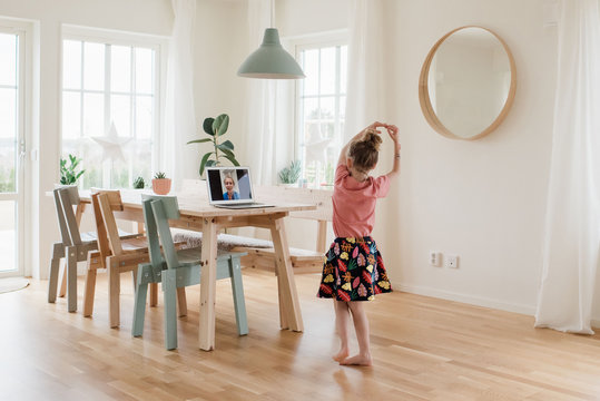 girl dancing on a video call for a nurse working in a hospital