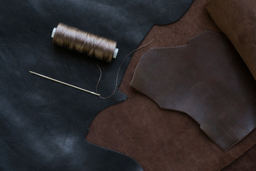 Sewing process of the leather. Tools, materials and accessories for leather workshop. Vintage sewing industrial