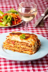 portion of fresh lasagna on a plate