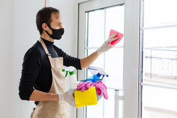 Cleaning and Disinfection at town complex amid the coronavirus epidemic. Professional teams for disinfection efforts. Infection prevention and control of epidemic. Protective gloves and mask