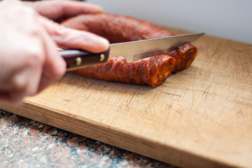 Traditional spanish chorizo sausage in wood surface