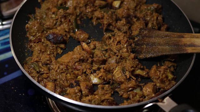 South Indian dish spicy beef fry Kerala, India. side dish ghee rice, appam, parotta, puttu, bread and chappathi, Kerala cuisine ,Buffalo roast / Meat pepper fry with coconut. India spices cooking,