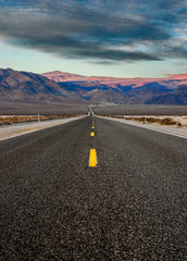 Morning landscape with a highway and mountains.
