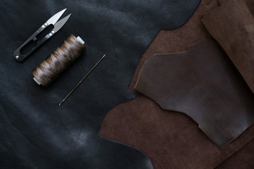 Sewing process of the leather. Tools, materials and accessories for leather workshop. Vintage sewing industrial