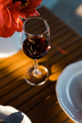 glass of red wine on a table close up