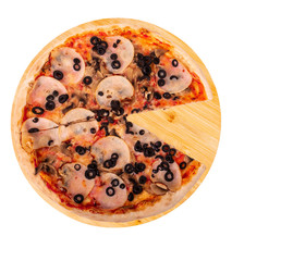 Tasty pizza with ham, mozzarella, mushrooms and olives, without one slice, on round wooden platter, isolated on white background, top view