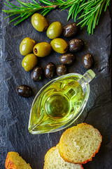 olive oil appetizer olives, cold pressed, 
menu concept food background. top view. copy spaces for text for text keto or paleo diet