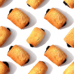 Poppy-seed cookies are on the white table. Seamless pattern. Isolated white background