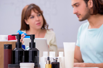 Obraz premium Young couple in network marketing concept