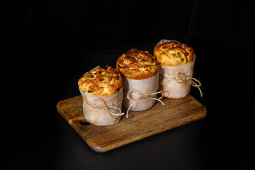 Baked cakes on a cutting board .