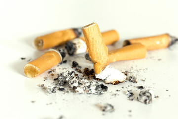 Cigarette butts on white background.Stop smoking concept