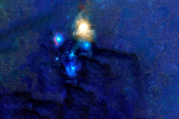 A blue galaxy with stars in deep space. Elements of this image were furnished by NASA.
