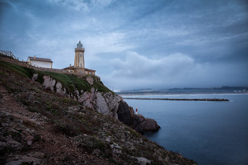 Fototapeta na wymiar Aviles lighthouse on the coast of asturias in Spain