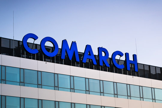 KRAKOW, POLAND - May 11, 2019 Comarch Business City of Krakow on the Jana Pawła II street, district modern buildings including the company logo of including the company Comarch.