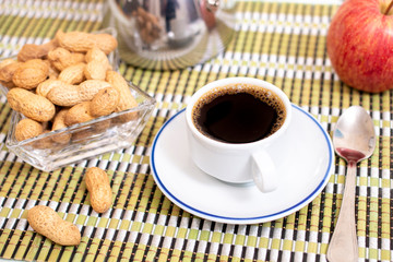 cup of expresso coffee with peanuts and fruit