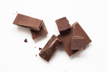 Chocolate pieces on white background