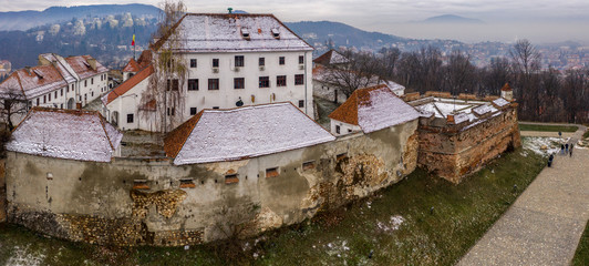 Brasov fortress citadel on Straja hill, Brasov, Romania. Aerial drone panoramic view