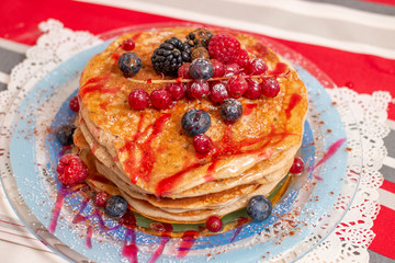 oats and banana pancakes with berries