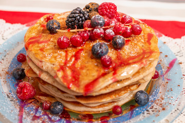 oats and banana pancakes with berries