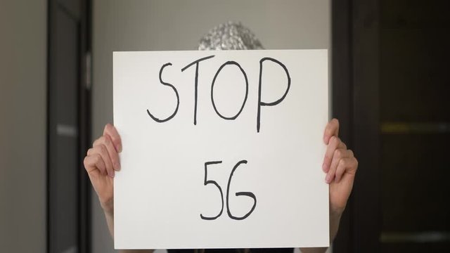 Close up shot of poster "STOP 5G" which people use in demonstration against 5G, shot with 1.33x anamorphic lens