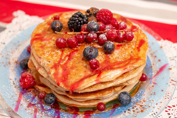 oats and banana pancakes with berries