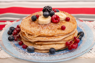 oats and banana pancakes with berries