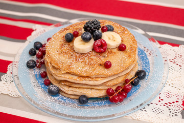 oats and banana pancakes with berries