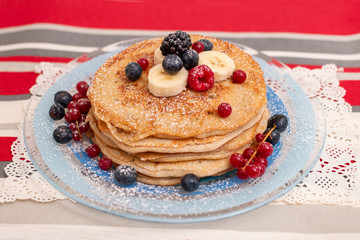 oats and banana pancakes with berries