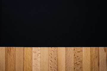 Wooden blocks on the black background. Copy space.