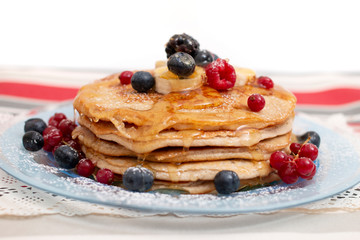 oats and banana pancakes with berries