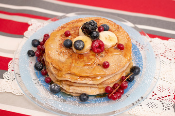 oats and banana pancakes with berries
