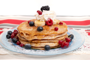oats and banana pancakes with berries