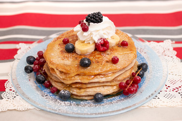 oats and banana pancakes with berries